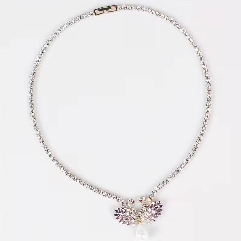 Elegante Schwanen-Halskette und Ohrringe mit rosa/lila Steinen